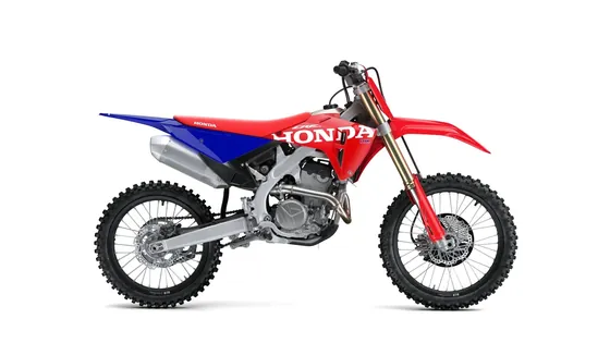 Motocross bike Honda CRF250R in red, white and blue from the side